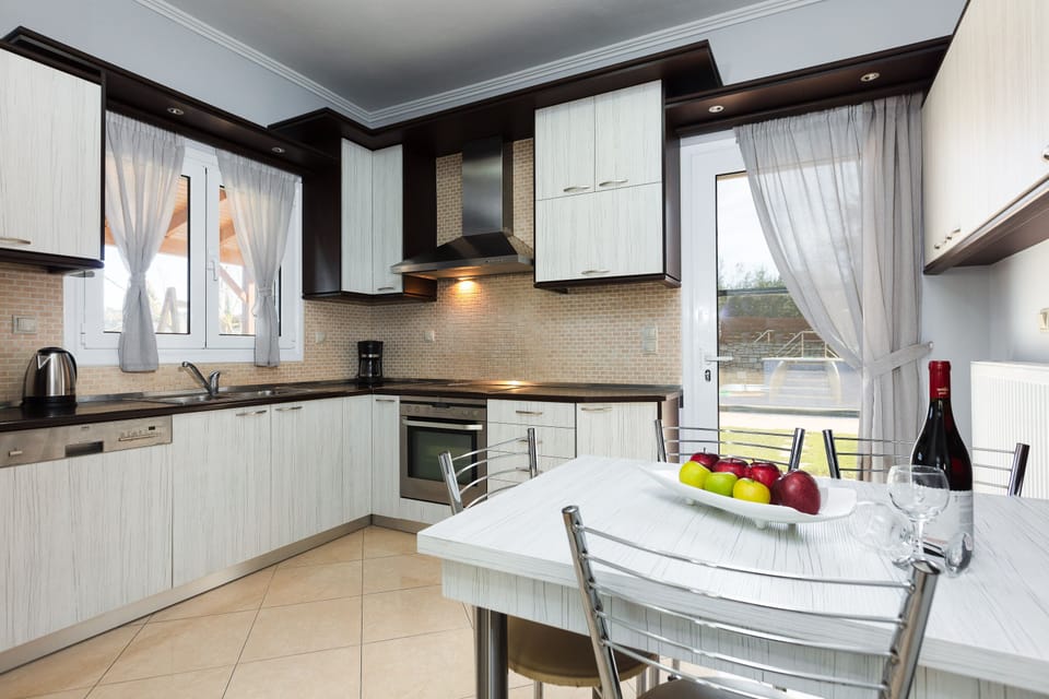 The kitchen is fully equipped and provides direct access to the pool terrace.