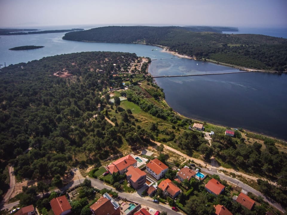 Aerial view . Our pool is the one you see front line to the sea
