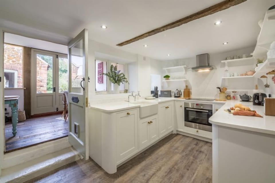 Ground floor:  The kitchen leads to the bright dining room