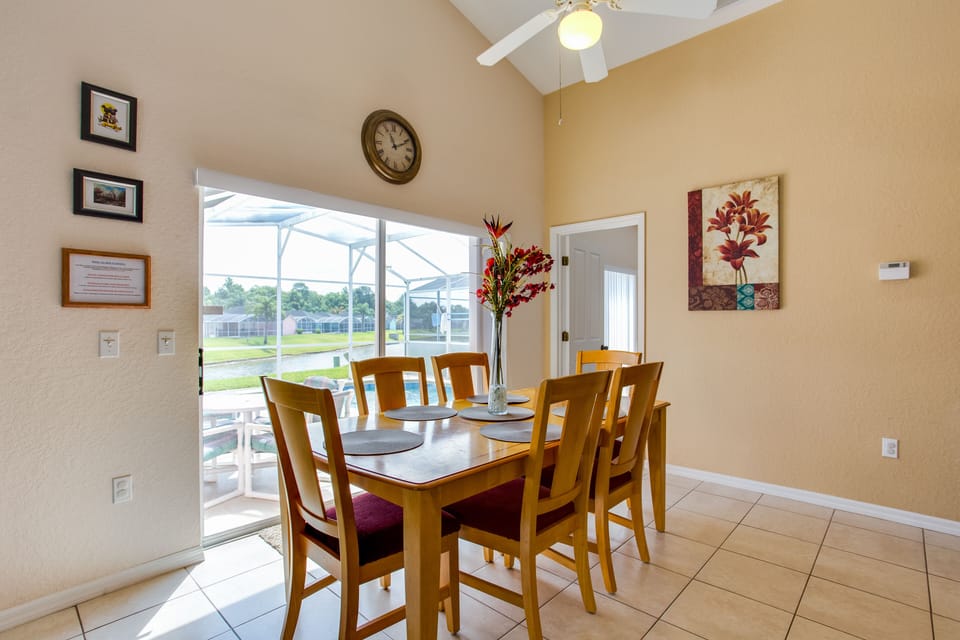 Dining area overlooking pool deck and lake