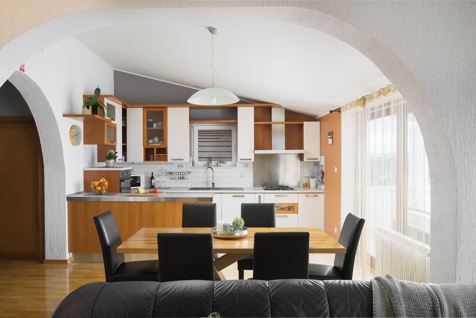 Fully equipped kitchen and dining area on the upper floor