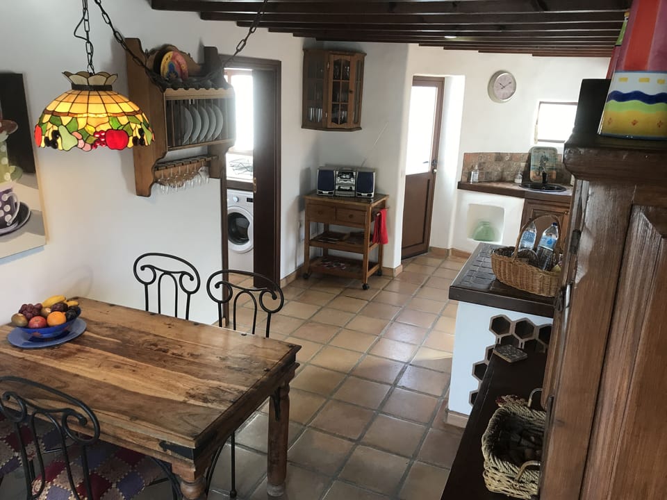Kitchen/dining room towards utility room door and back door
