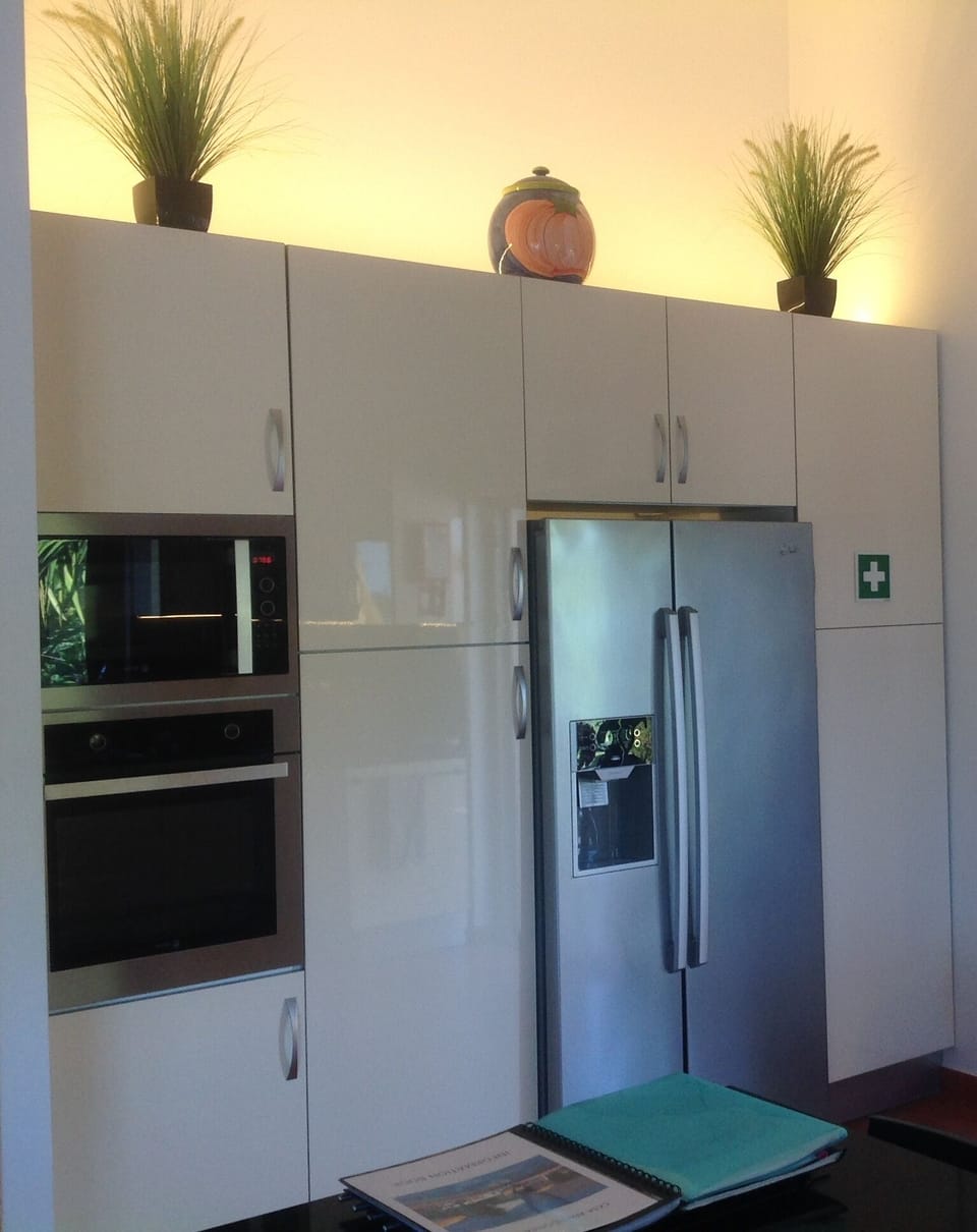 Kitchen including oven, microwave/grill and large fridge freezer