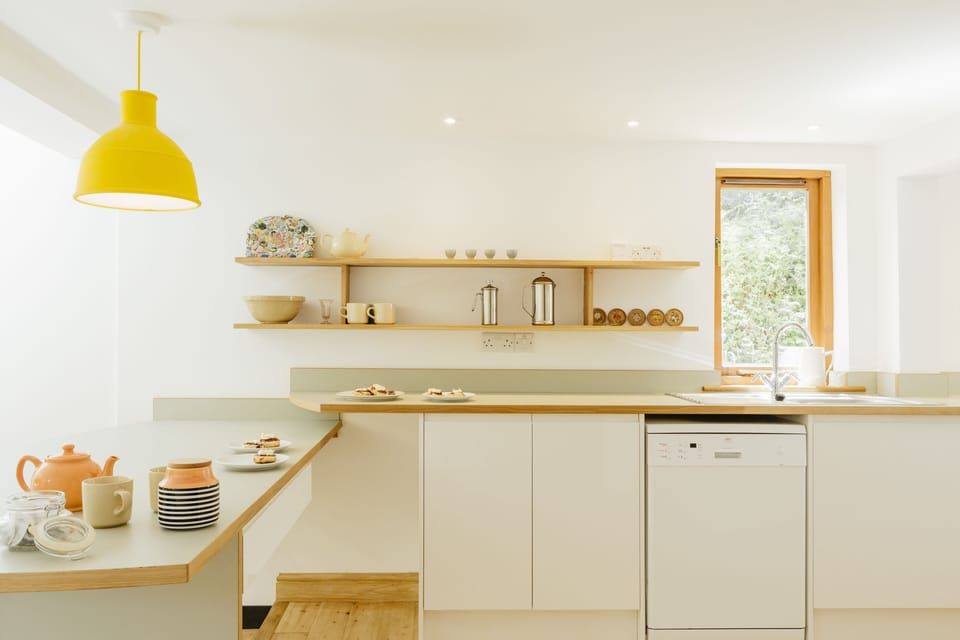 Well appointed kitchen area with kitchen sink facing a bird feeder to watch!