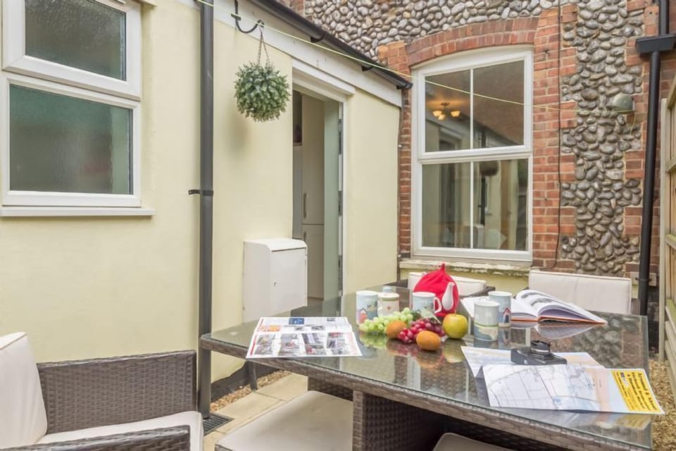 Small enclosed courtyard with table and chairs