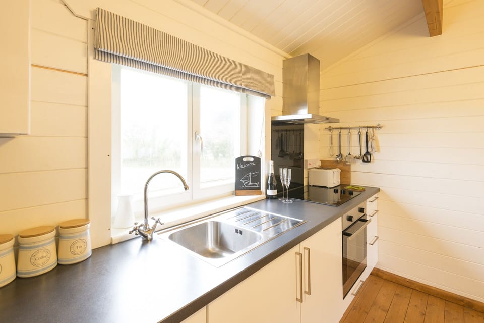 Well-equipped kitchen with oven, hob, microwave and dishwasher