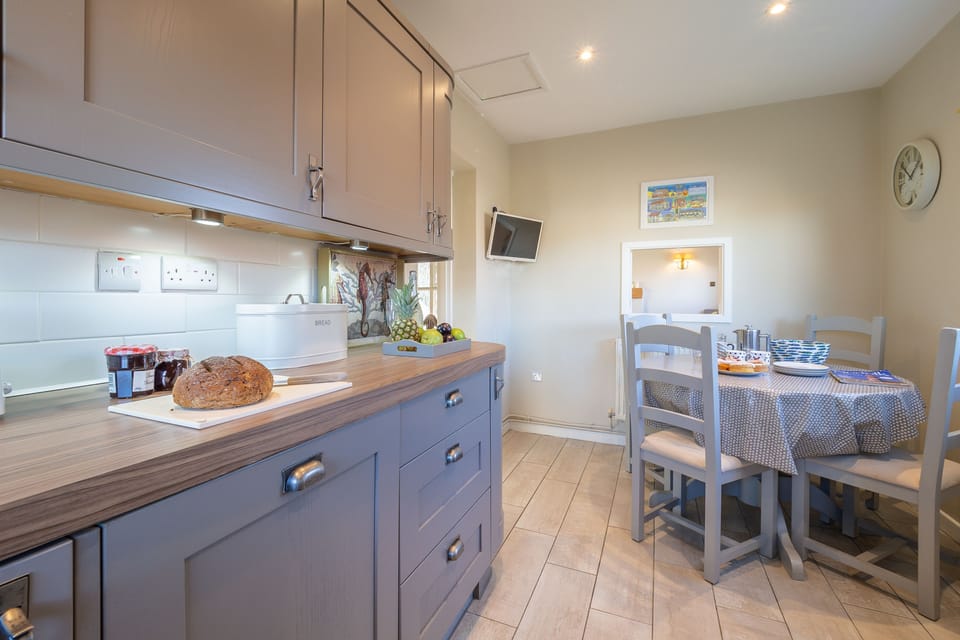 Ground floor: The kitchen also has table seating four