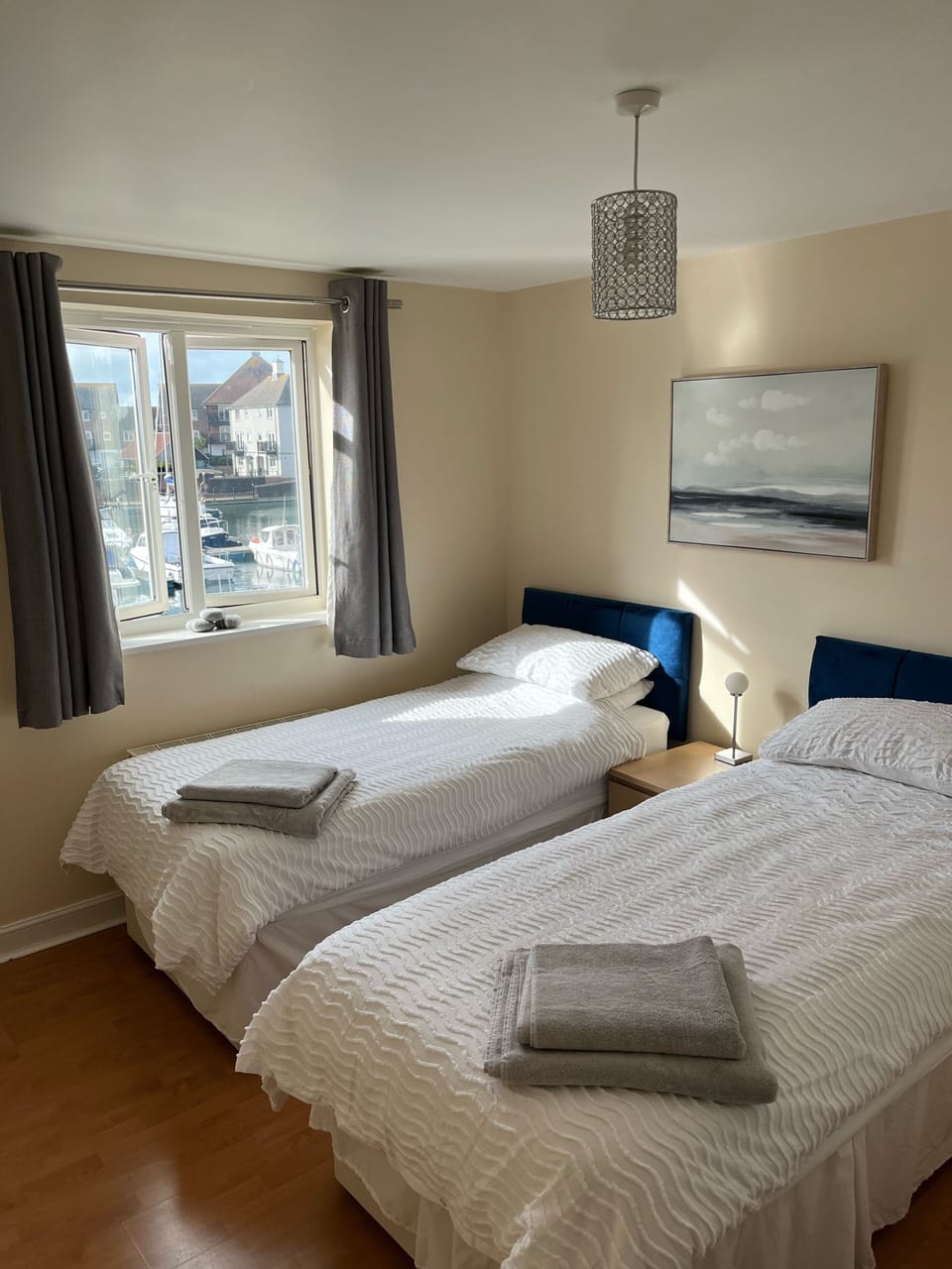 Second bedroom, with views out onto the southern Marina