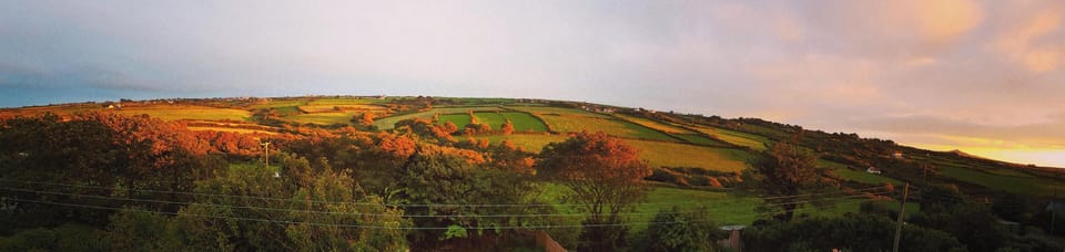 Evening view of valley and sea from back of house

