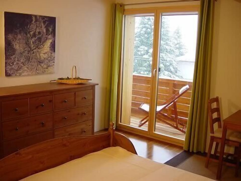 Spice bedroom with balcony
