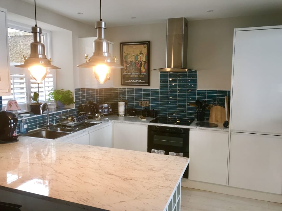 Spacious kitchen with loads of worktop for preparation of culinary delights.