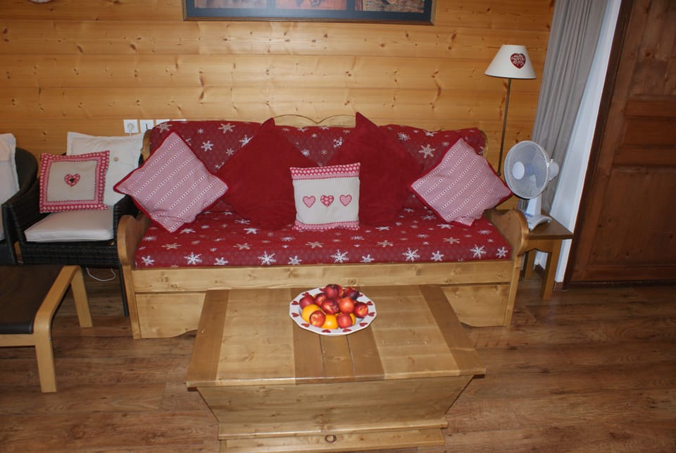 Bed settee in living room. converts to 2 full size single beds