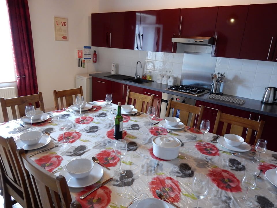 Large farmhouse table - easily seating 10 guests. Very well equipped kitchen.