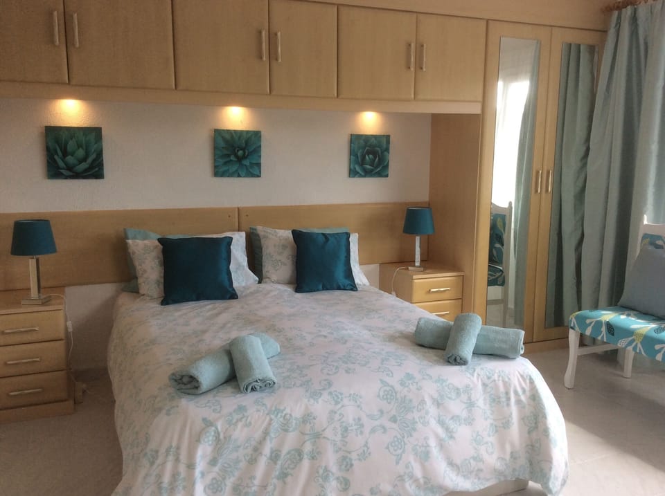 Master bedroom . Bright and airy . Doors leading to terrace . Air conditioning 