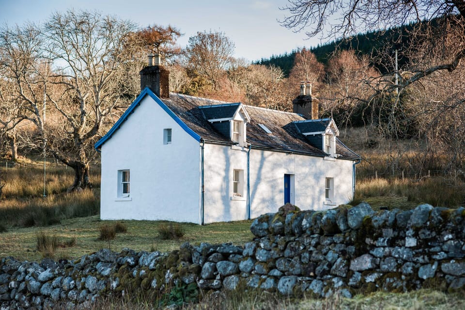 A winter view of Liddesdale Cottage from the loch-side.