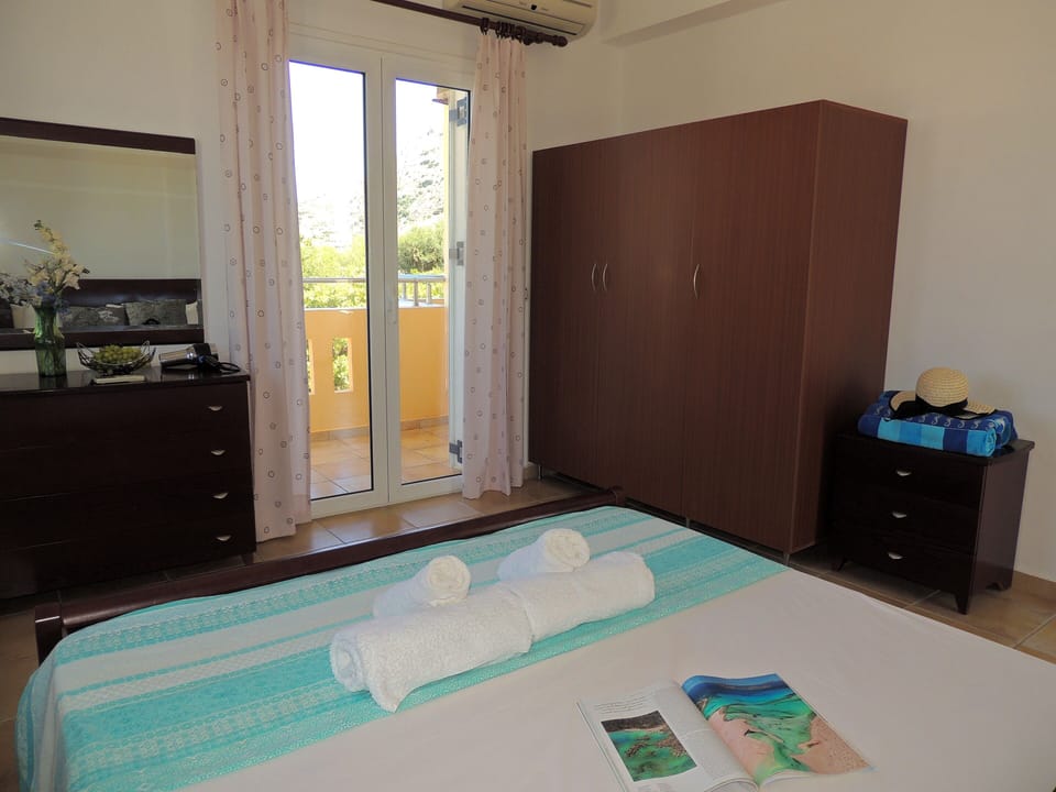 31 Nostalgia master bedroom with doors to balcony.