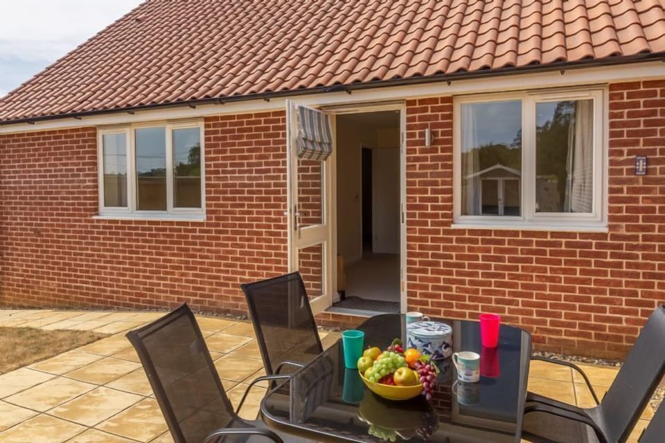 With patio area with table with seating for four