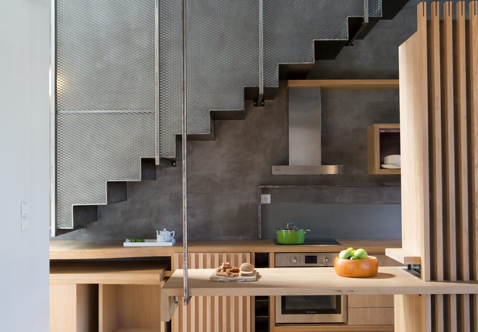 The Kitchen and the top designed metal staircase