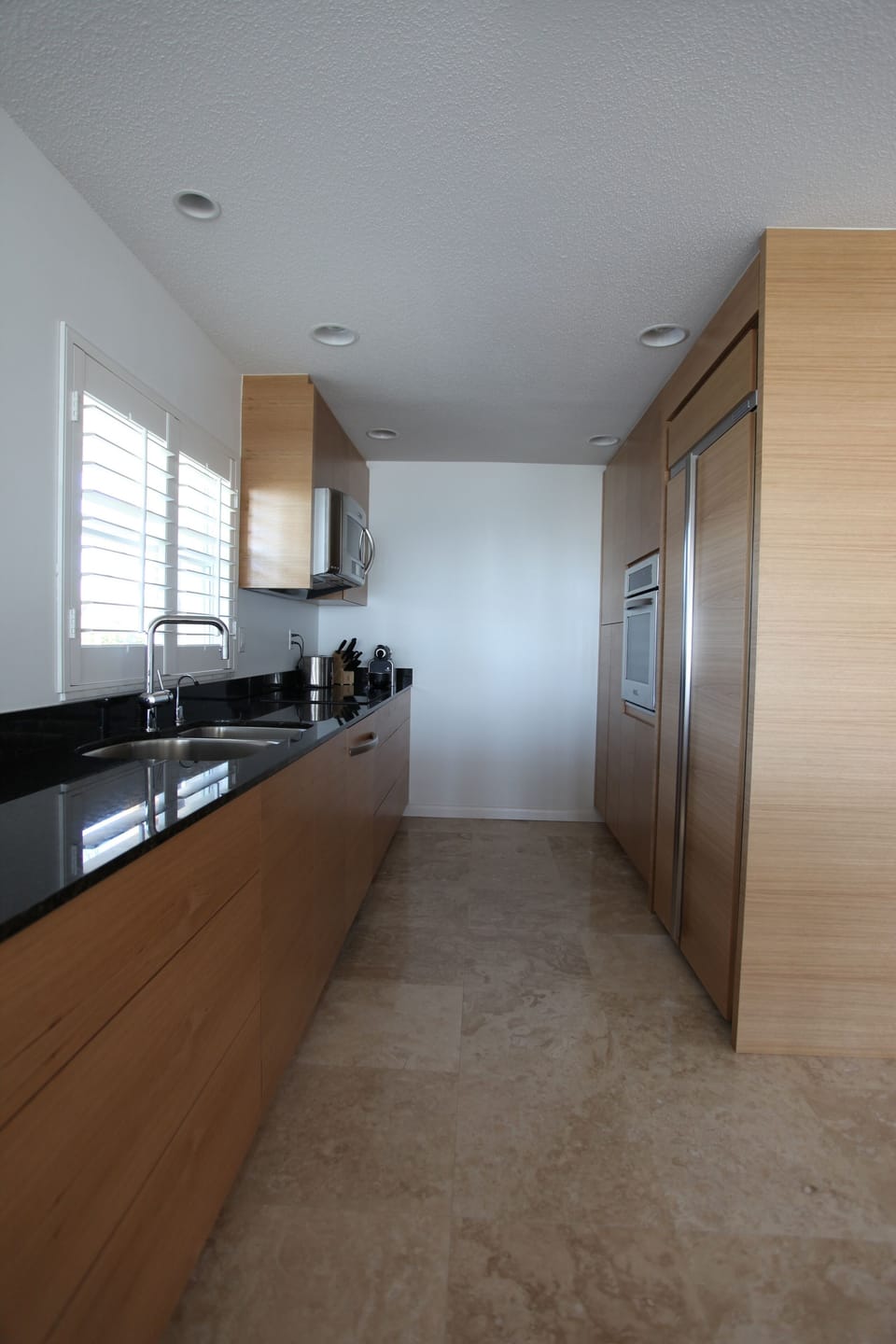 Contemporary gripless kitchen with a-grade appliances.