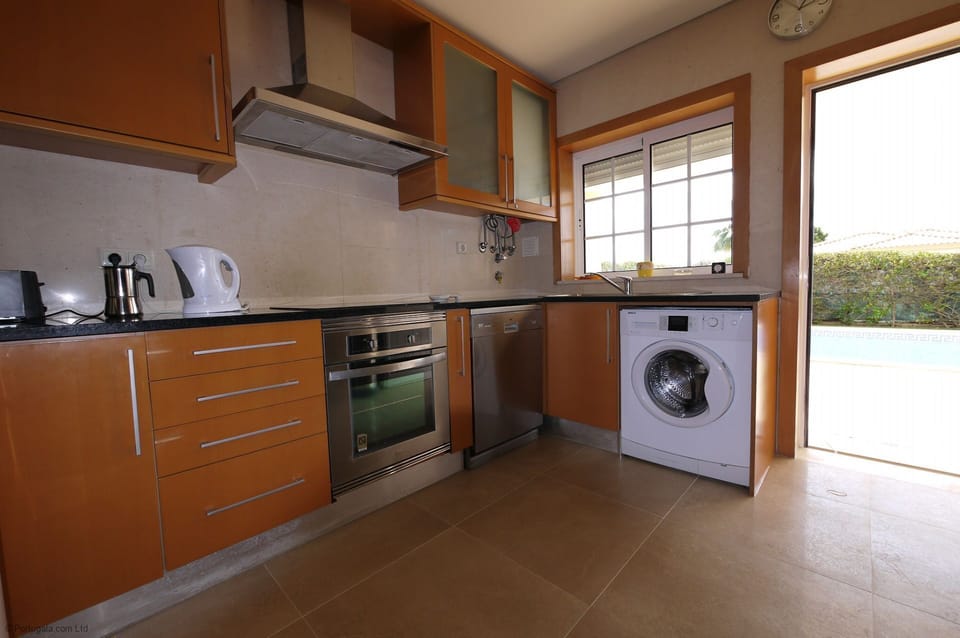Fully equipped kitchen with sea views, overlooking the saltwater pool, established garden & Lawn. Complete with individual sound system. Access via double sliding double doors to lounge with dinning table and 12 high back comfortable dinning chairs.