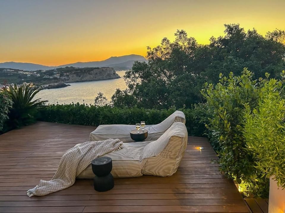 Peaceful sunrise view over the bay from a private terrace