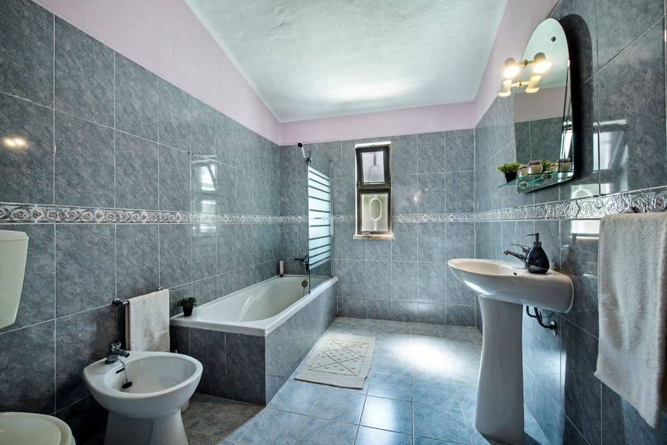 Bathroom with bath-shower and toilet