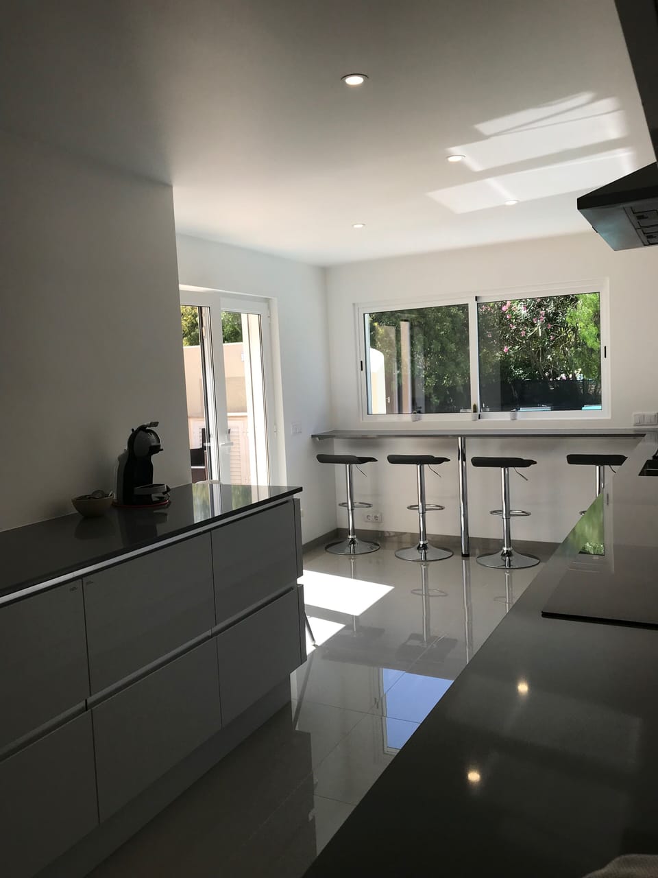 Kitchen with double doors opening onto spacious terrace