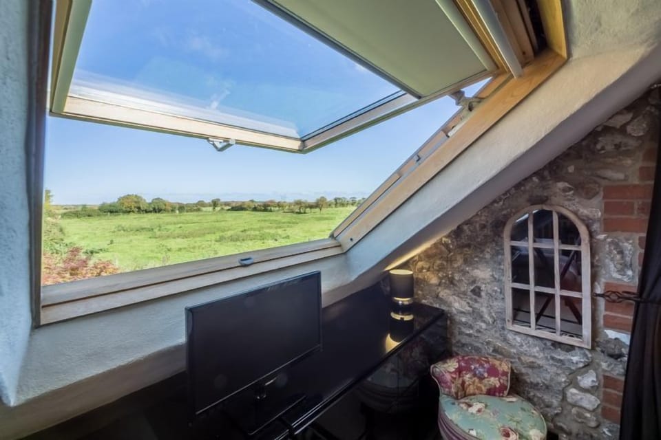 The master bedroom overlooks Holme Dunes Nature Reserve