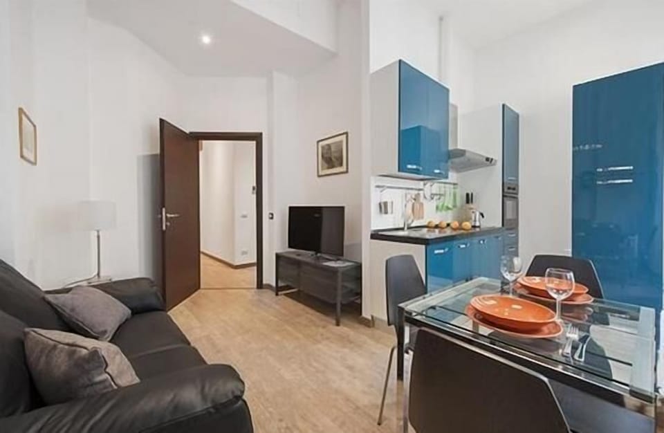 living room and kitchen with TV