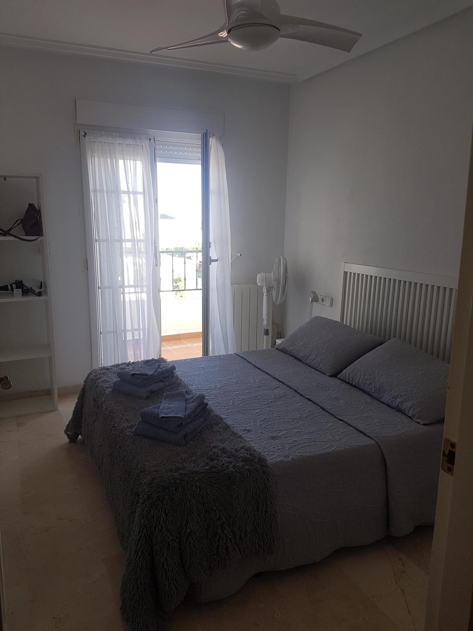 Main Bedroom with doors onto balcony with built in wardrobes