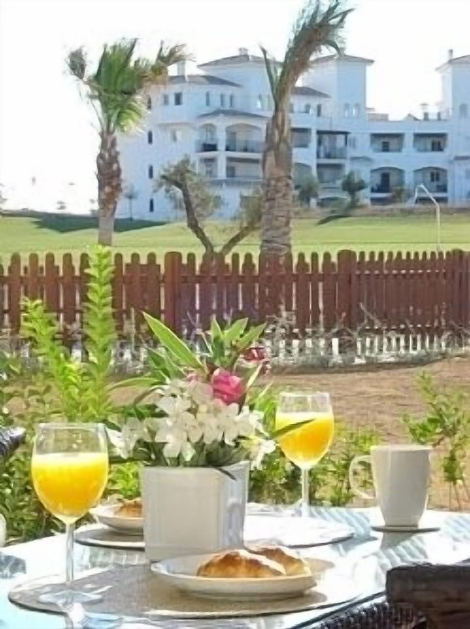 Terrace view of pool and golf course