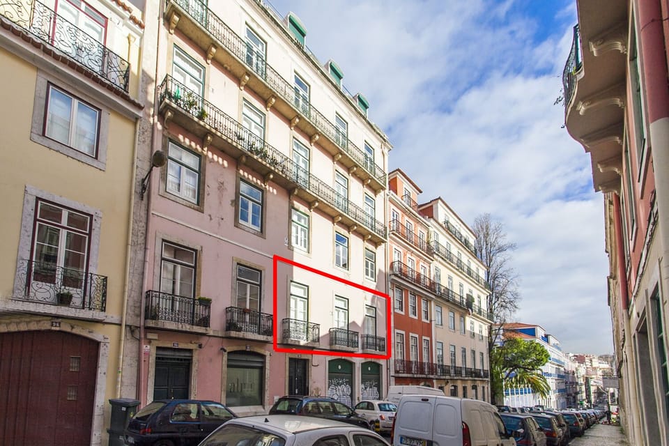 Apartment is circled in red, on the first floor with three balconies. 