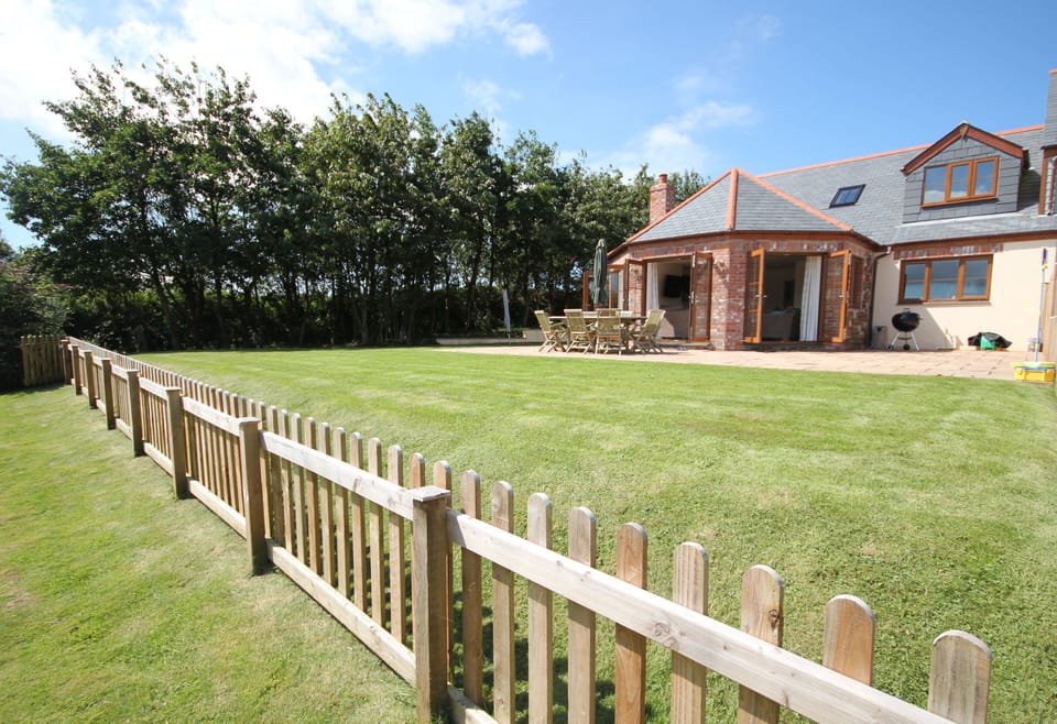 Back of the house with field in the foreground