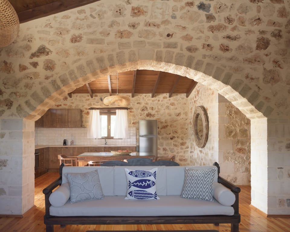 First floor living area with fully equipped kitchen in the background.