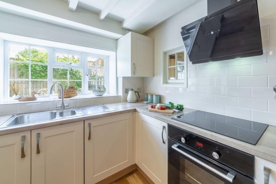 Ground floor:  Kitchen/breakfast room with fan oven and induction hob