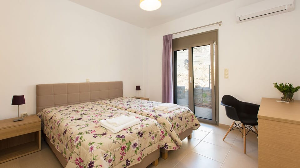 Bedroom on the ground floor with access to the pool area