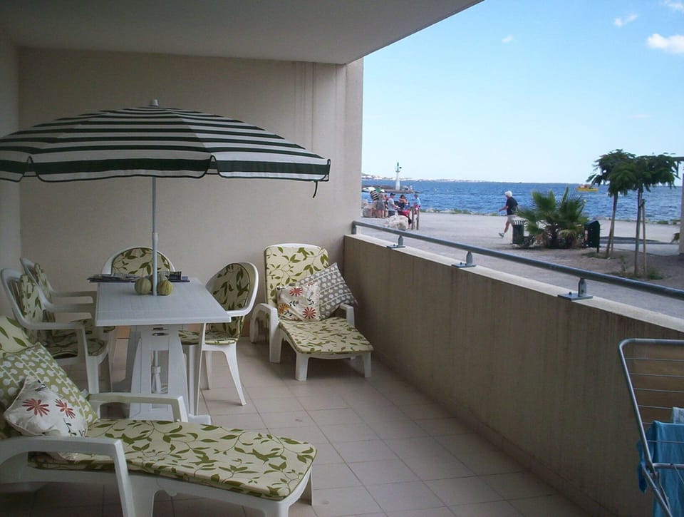 Large balcony, south facing to the beach and sea.