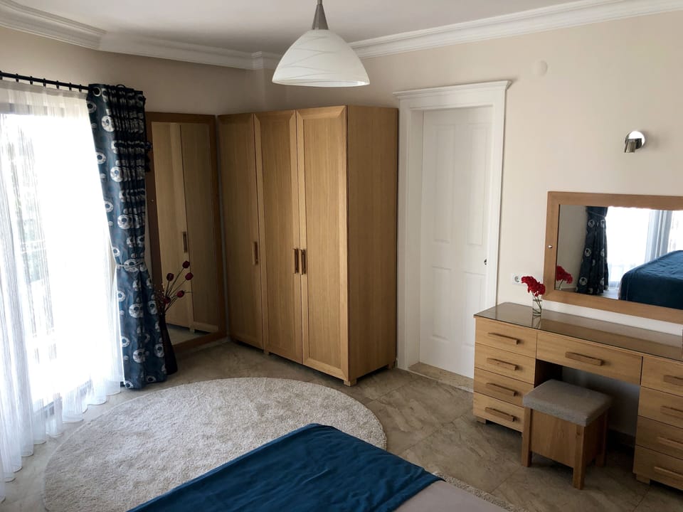 Master Ensuite Bedroom with Double Aspect Windows and Access to Vera
