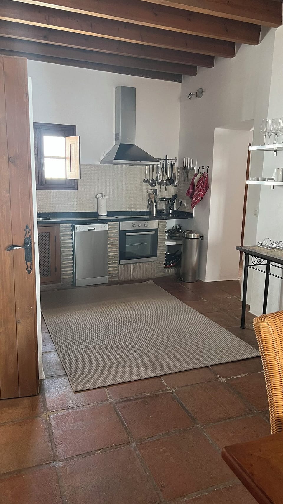 Kitchen with modern appliances - dishwasher, electric cooker and washing machine