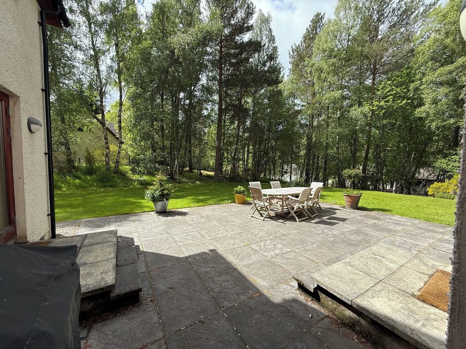 Patio and gas BBQ accessed by French doors from kitchen and lounge; also hall dr