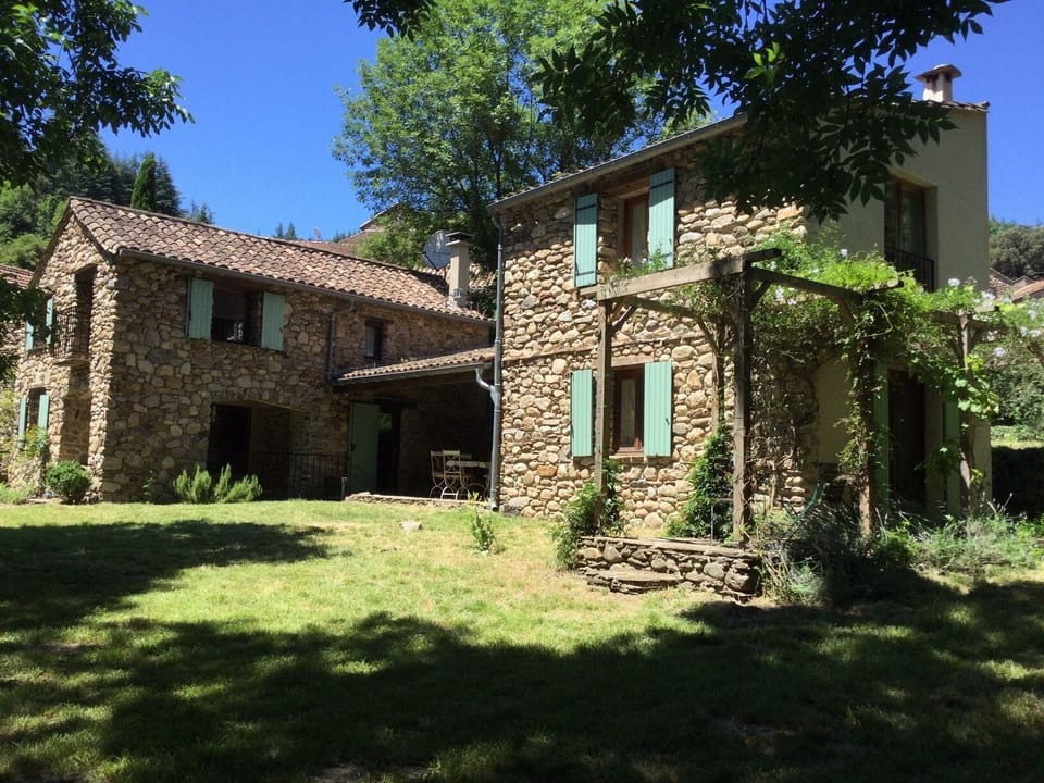 The house seen from the stream