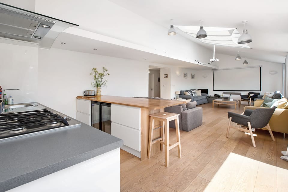 cinema lounge showing bar, drinks fridge, kitchenette