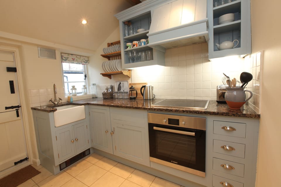 The Kitchen with stable door out to the Courtyard
