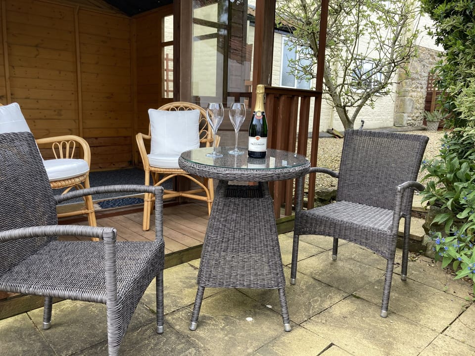 Garden furniture outside summerhouse