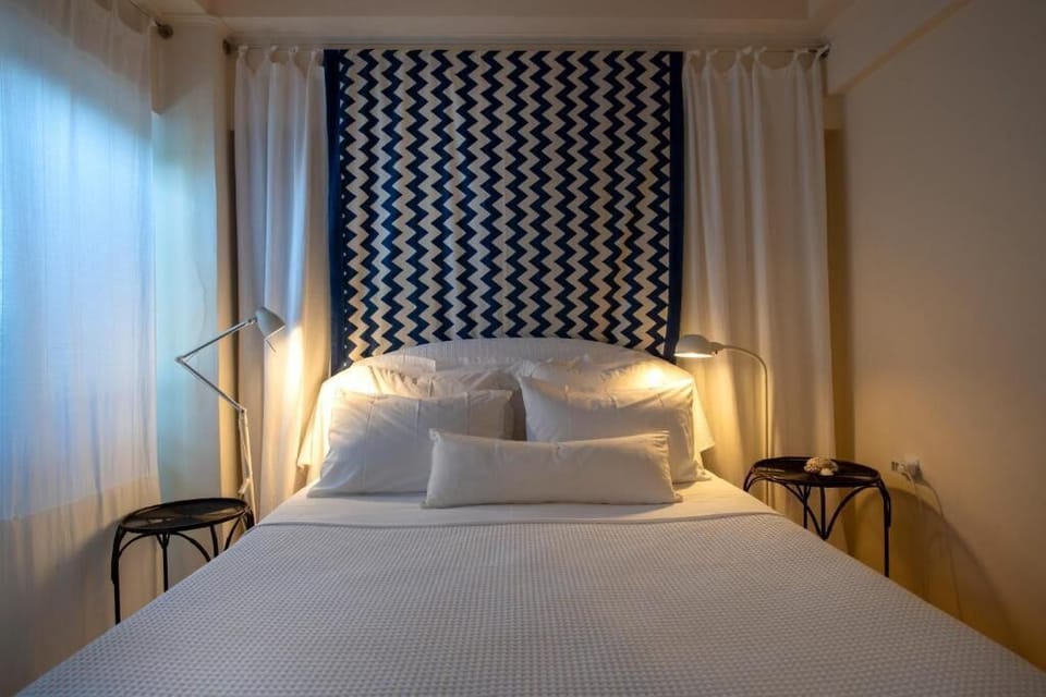 Peaceful bedroom with soft linens and ambient lighting