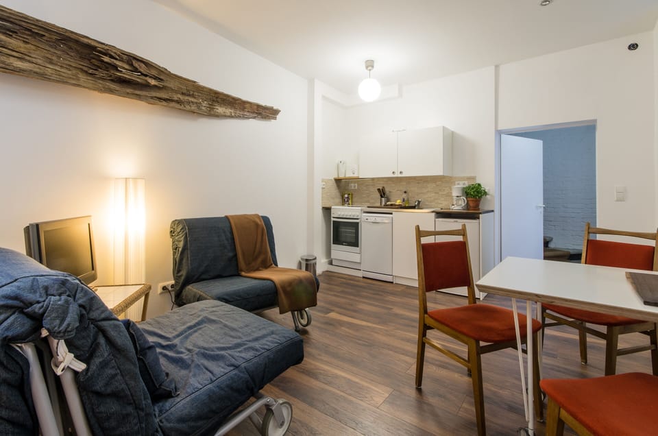 living room with open kitchen and entrance