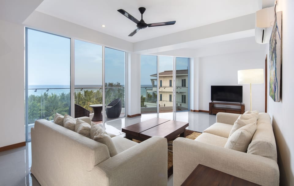 Luxury Apartment, Multiple Beds, Accessible, Ocean View | Living room | 50-inch LED TV with premium channels, TV
