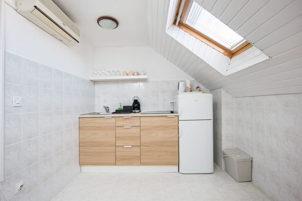 Classic Apartment | Private kitchen | Fridge, espresso maker, electric kettle, cleaning supplies
