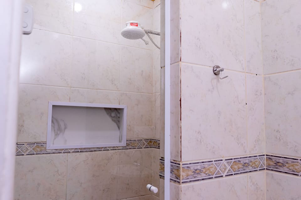 Standard Double Room, 1 Double Bed | Bathroom | Shower, free toiletries, towels, soap
