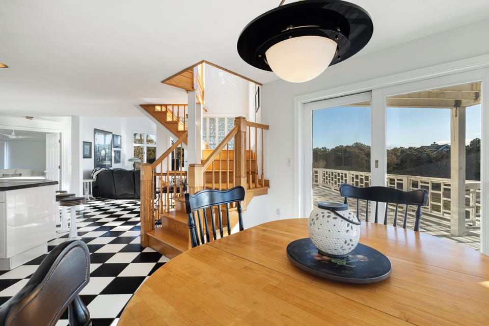 Second floor: kitchen with open floor plan + wrap around deck
